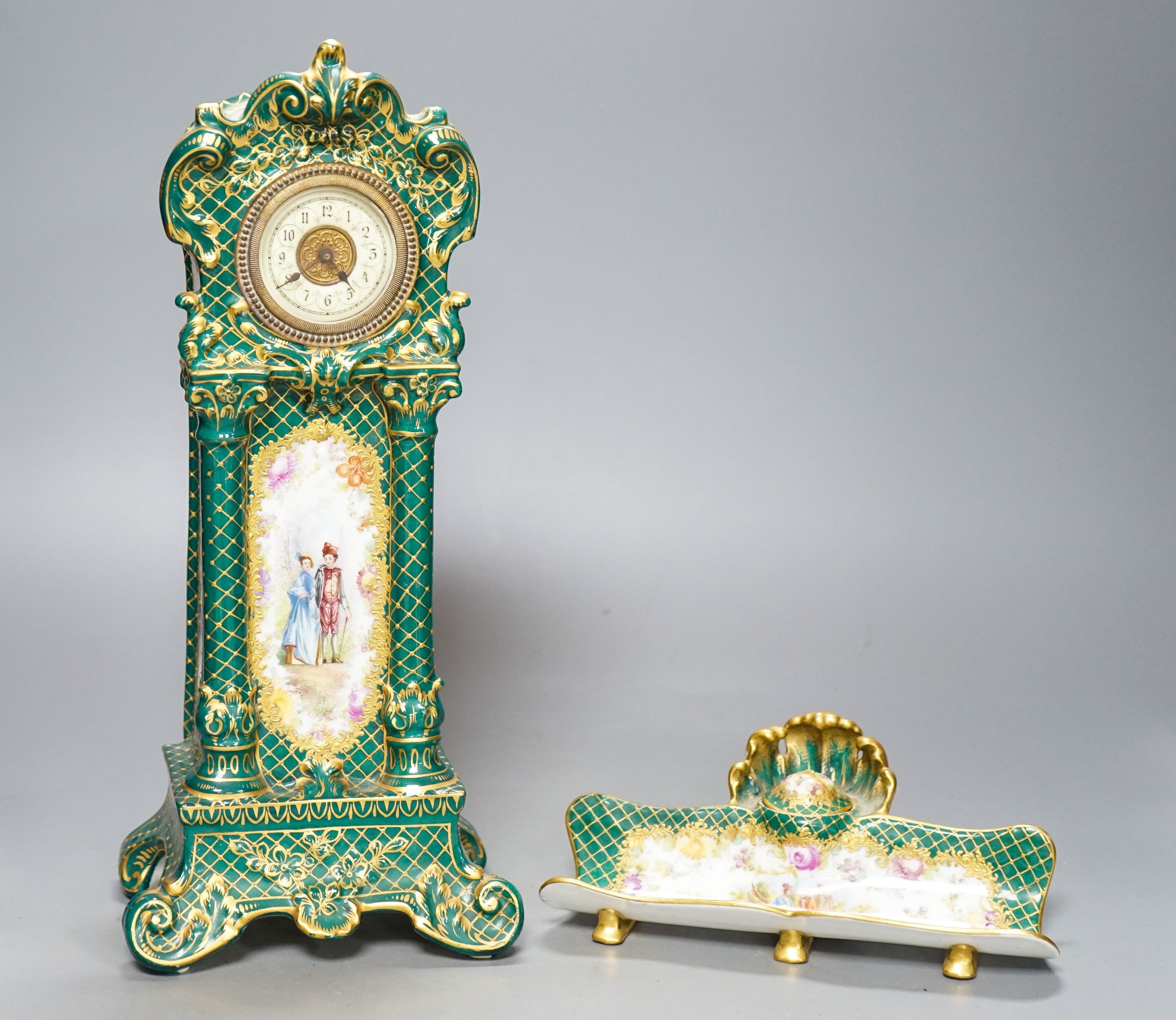 A Dresden porcelain model longcase timepiece and matching ink stand 34cm